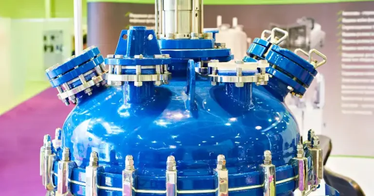 Chemical reactor vessel with flanged nozzles and a manway — industrial process equipment