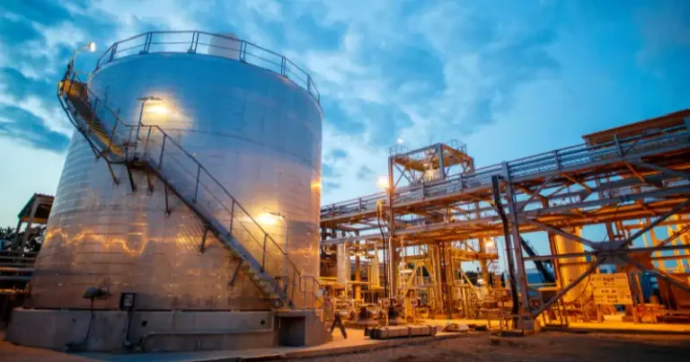 Industrial storage tank and process piping system in a chemical plant, illustrating typical equipment involved in SIL and LOPA evaluations.